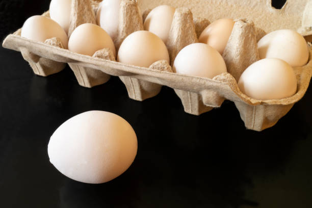 istock Chicken egg in sulphur to packing from paperboard 1218579938