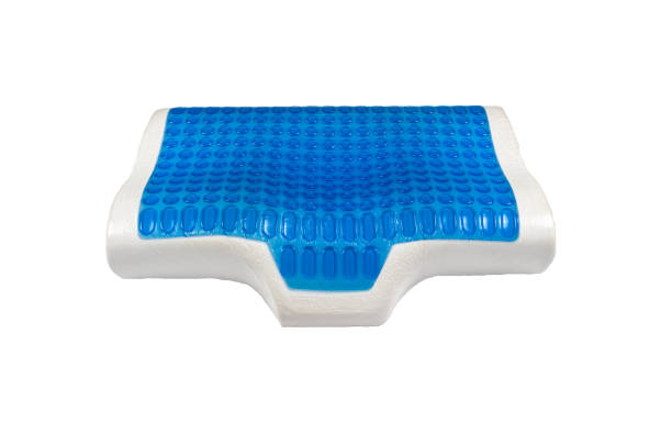 istock Orthopedic latex pillow with memory foam effect, hydro gel layer, cooling effect. Medical treatment pillow for sleep under the head with a recess under the neck isolated on white background. 1218580313