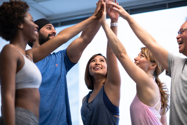 istock Group of diverse people exercising together 1218580502