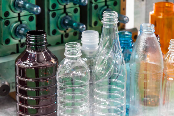istock The various type of  plastic bottles and the preform shape with the injection mold background in the drinking water factory. 1218582200