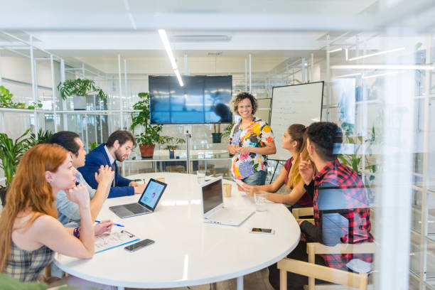 istock Woman engineer presenting during team meeting 1218582765