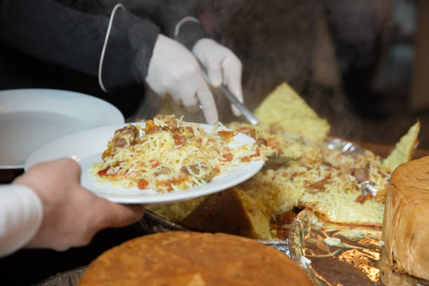 istock Khan pilaf in a pita. Traditional oriental dish on tableware Azerbaijan with fire on a table in restaurant .the chef cuts off the drill. Shah pilaf. 1218584112