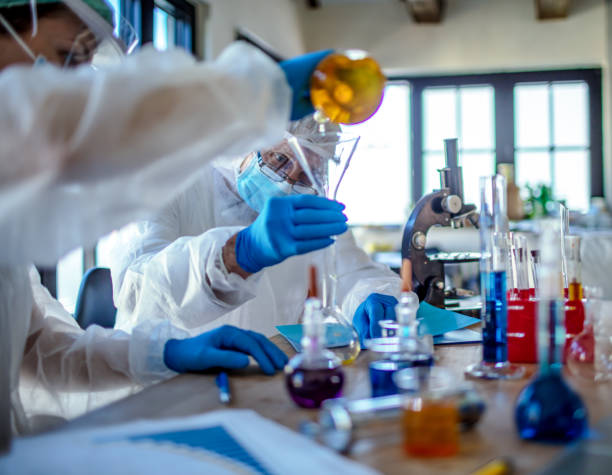 istock Microbiologist in the laboratory analysis and sampling of Covid-19 1218584692
