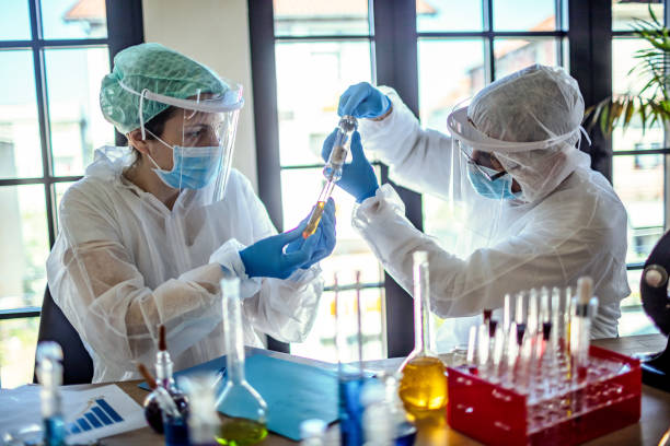 istock Microbiologist in the laboratory analysis and sampling of Covid-19 1218585436