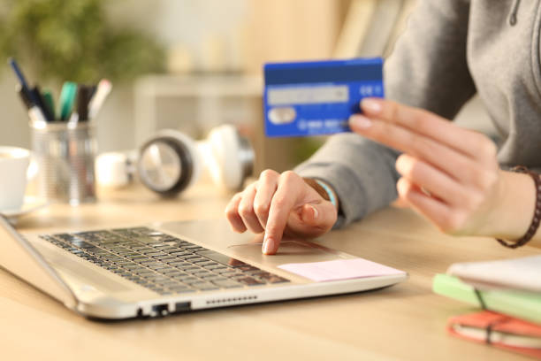 istock Student hands paying on laptop with credit card 1218585813