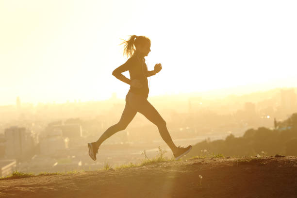 istock Profile of a runner silhouette running at sunset 1218586100