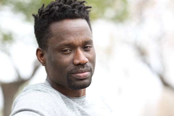 istock Confident black man looking at camera in the park 1218586217