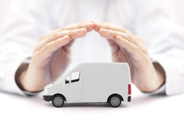 istock Transport white van car protected by hands 1218587058