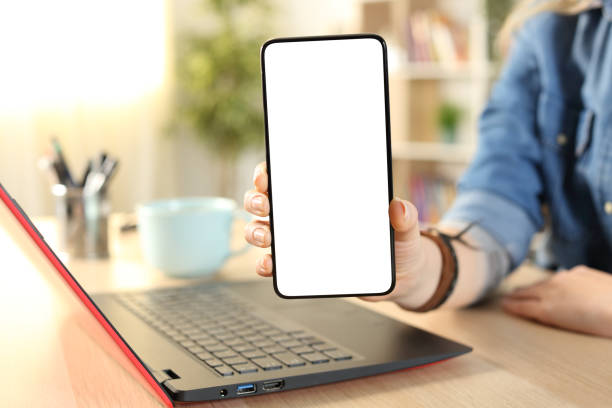 istock Student hands showing blank phone screen at home 1218587086