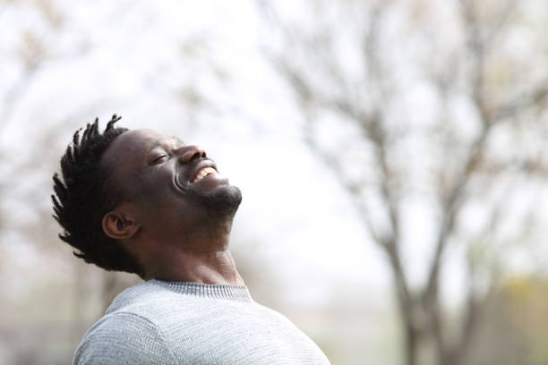 istock Happy black man breathing fresh air outdoors in winter 1218588195