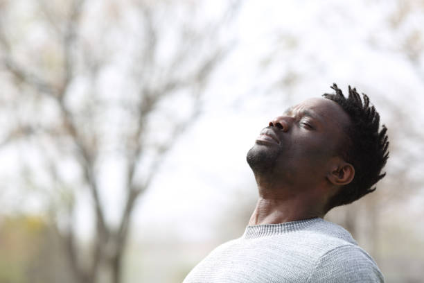 istock Black man breathing fresh air outdoors in winter 1218588439
