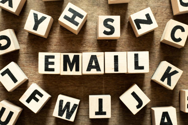 istock Letter block in word email with another block on wood background 1218588710