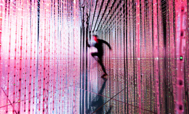Man running in the pink lights.