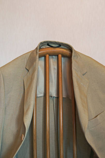 male jacket hanging on chair
