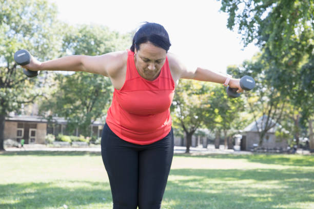 istock Woman exercising outside in the park 1218590246