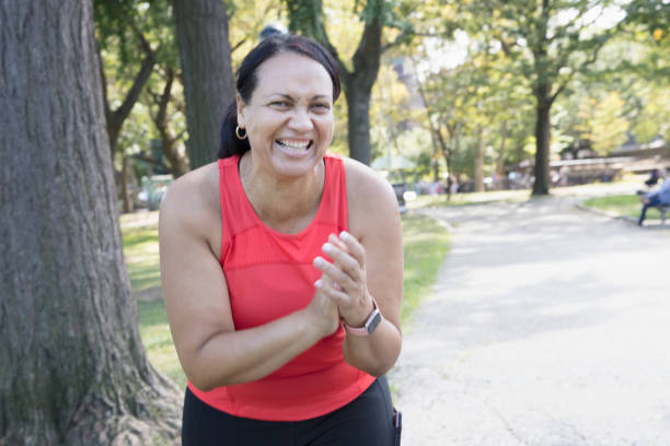 istock Woman exercising outside in the park 1218590292