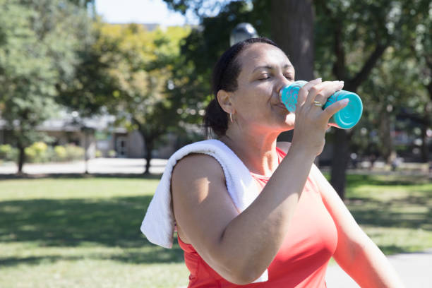 istock Woman exercising outside in the park 1218590564