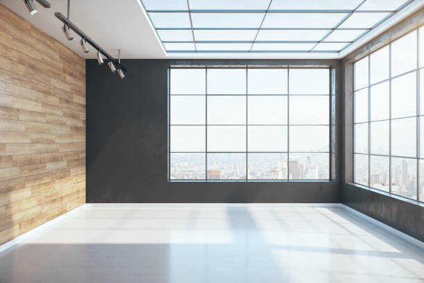 istock Sunny minimalistic interior with blank wooden wall 1218592337