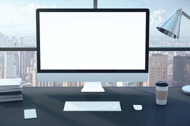 istock Futuristic office interior with computer and supplies 1218592491
