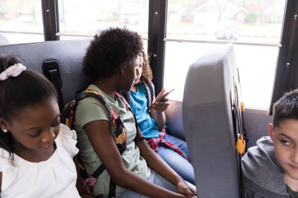 istock Elementary age girls look at smart phone screen 1218592616