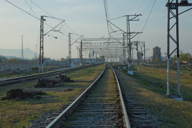 istock Railroad tracks . Straight railway line . Empty summer railway . local railway and train station . 1218593749