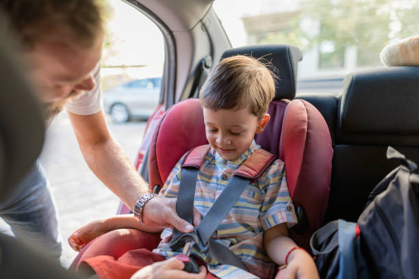 istock Father putting safety belts on his son 1218593854