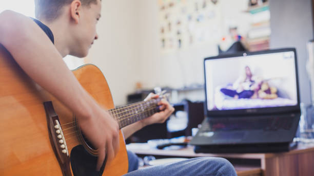 istock Teleconferencing to play music - having fun on lockdown 1218594498