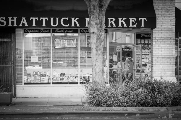 Berkeley residents stop into Shattuck Market for supplies during the COVID-19 outbreak. Berkeley, California, USA - April 9, 2020: berkeley california stock pictures, royalty-free photos & images
