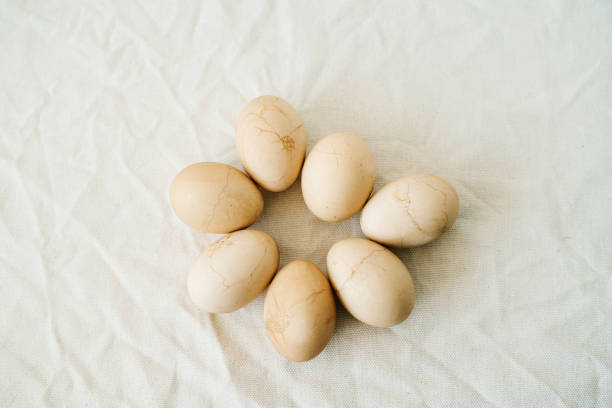 istock Seven Easter eggs trendy pastel colored with cracks lie on the table on a light tablecloth. top view. minimal style. easter concept.copy space for text 1218595741