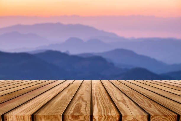 istock Brown wooden plank on layer colorful mountain 1218595760