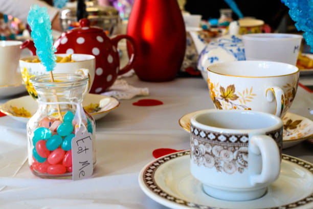 istock Mad hatter tea party with candy and tea cups 1218597487