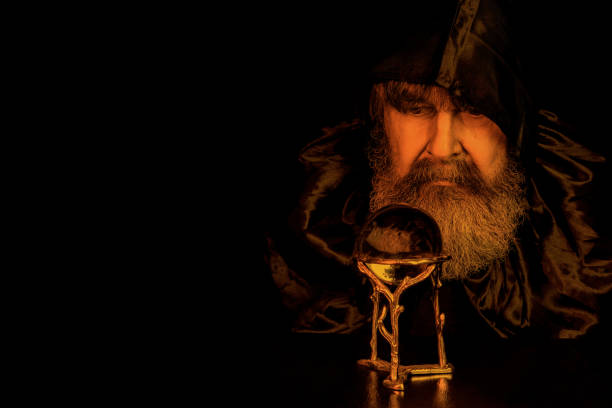 istock Wizard Gazing At Crystal Ball 1218598022