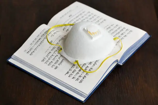 N95 Mask and hebrew prayerbook