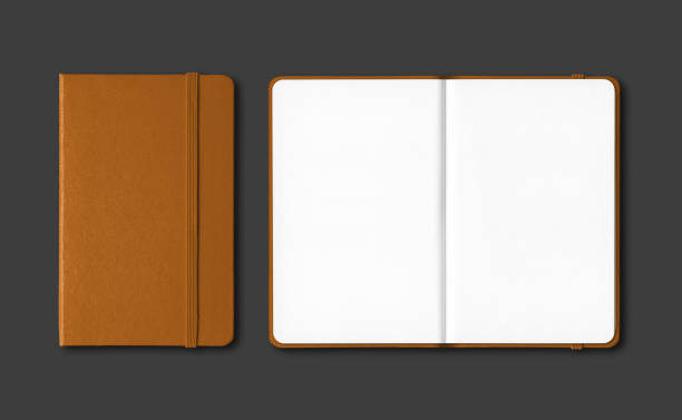 istock Leather closed and open notebooks isolated on black 1218599570