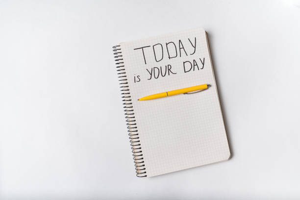 istock Motivational inscription in notepad TODAY IS YOUR DAY. Notebooks and pen. Handwriting 1218600006