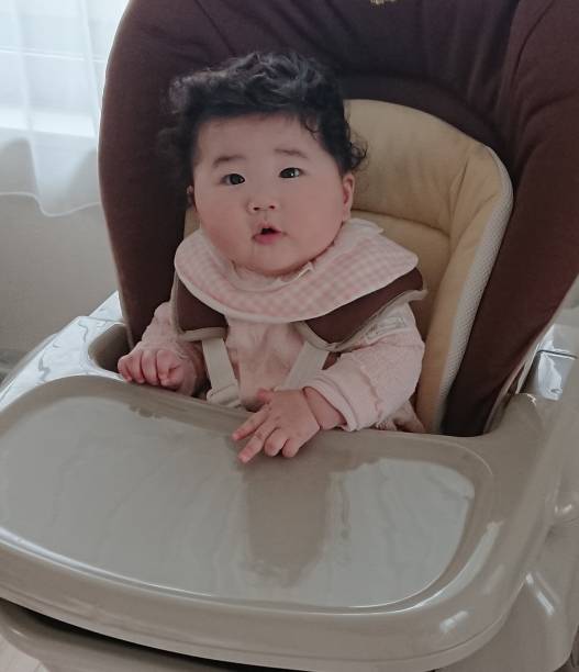 istock 5 months old baby smiling in a stroller 1218601000