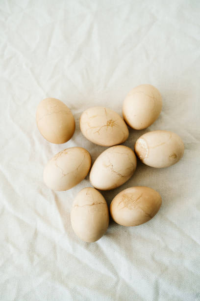 istock Seven Easter eggs trendy pastel colored with cracks lie on the table on a light tablecloth. top view. minimal style. easter concept.copy space for text 1218602502