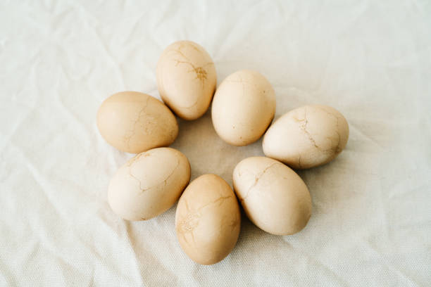 istock Seven Easter eggs trendy pastel colored with cracks lie on the table on a light tablecloth. top view. minimal style. easter concept.copy space for text 1218602838