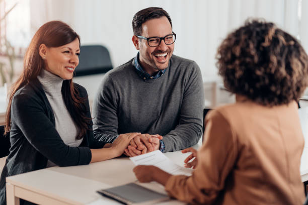istock Married couple talking with financial advisor on a meeting 1218602864