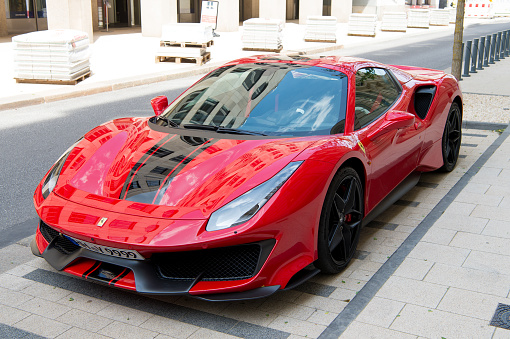 Hamburg, Germany-July 27, 2019: Supercar red Ferrari 488 Pista parked at the street in Hamburg, Germany. Ferrari 488 Pista is famous expensive automobile brand car