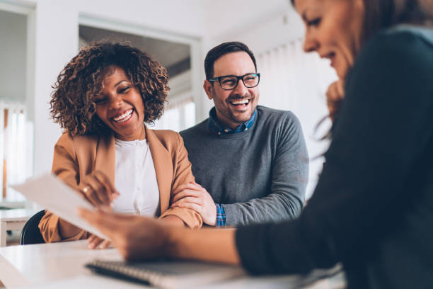 istock Married couple talking with financial advisor on a meeting 1218602958