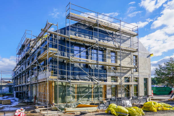 reconstruction of an old house with extension reconstruction of an old house with extension, scaffolding around the house rebuilding stock pictures, royalty-free photos & images