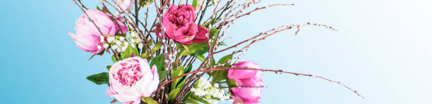istock Peony flower bouquet on blue background. 1218605715