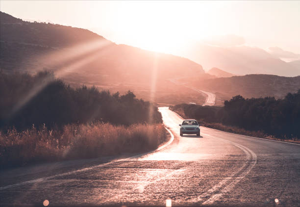 istock Car riding in countryside during sunset 1218606034