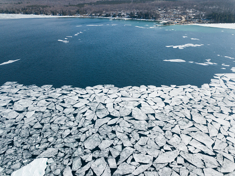 Drone filming the melting of winter ice in Lake Ontario, Canada