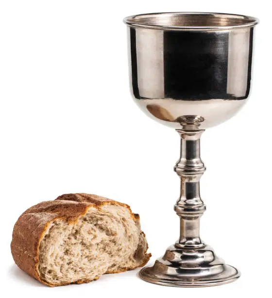 holy communion chalice with wine and bread isolated on white background.