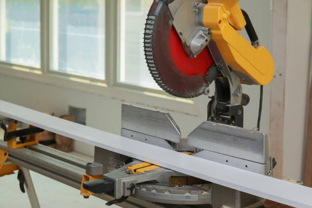istock Details new home installing construction building industry interior circular saw cutting wooden base molding 1218609183