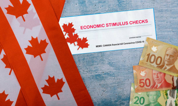 istock Canada doubles value of coronavirus stimulus economic response plan Canadian flags canadian dollar bills on background 1218609206