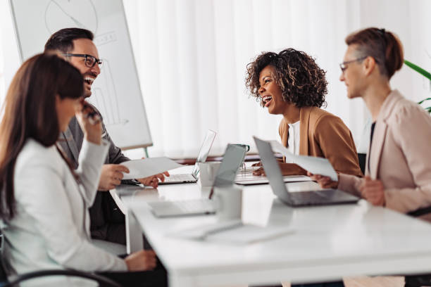 istock Multi ethnic group of business people having small talk and laughing 1218610159
