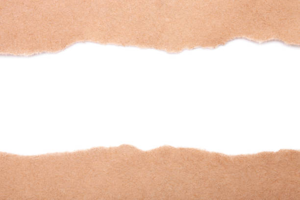 istock Torn craft paper isolated on white background. Brown paper texture with place for text, top view 1218612235